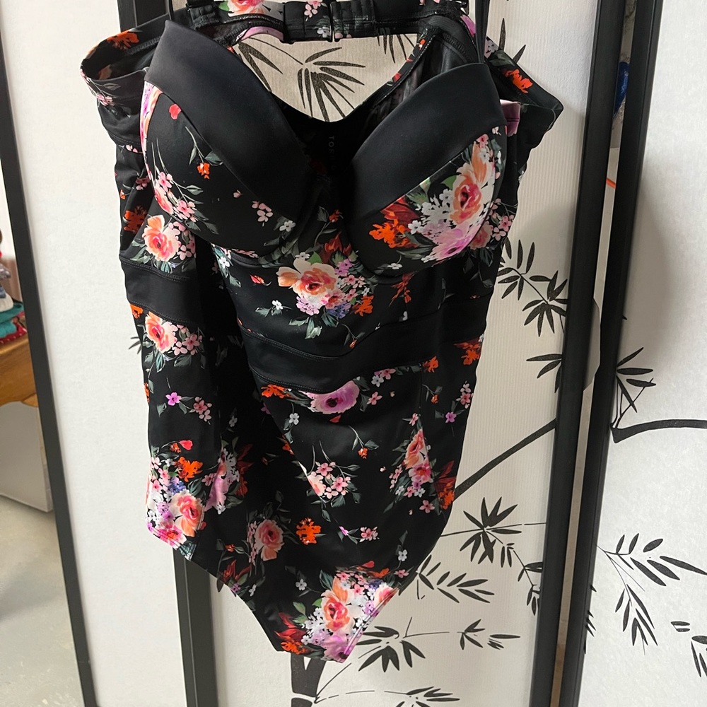 Torrid one piece suit with pad top.